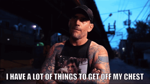A Man With A Lot Of Tattoos Has The Words I Have A Lot Of Things To Get Off My Chest Below Him GIF