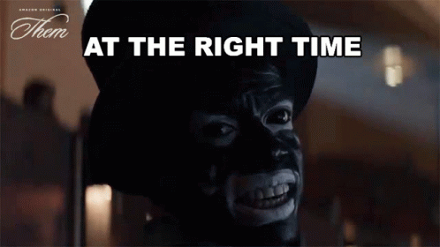a man with a mask on his face and the words at the right time below him
