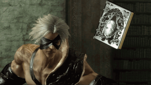 A Man With A Mask On His Face Is Holding A Book GIF