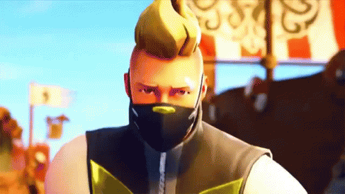 A Man With A Mask On His Face Is Looking At The Camera GIF