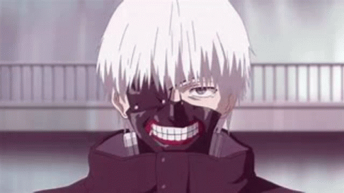 A Man With A Mask On His Face Is Smiling . GIF