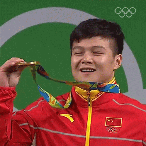 A Man With A Medal Around His Neck That Says China On It GIF