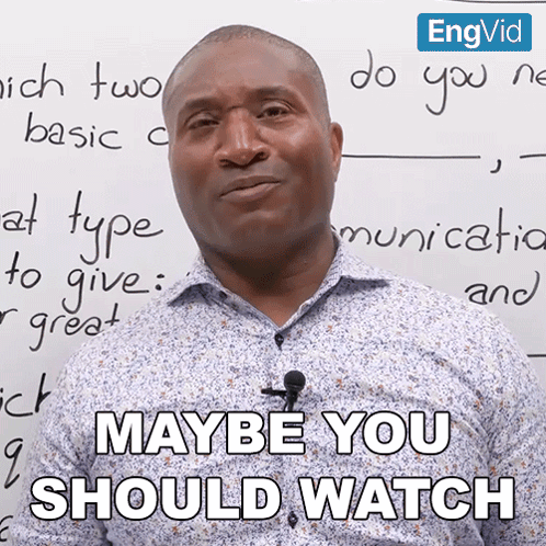 A Man With A Microphone In Front Of A Whiteboard That Says Maybe You Should Watch GIF