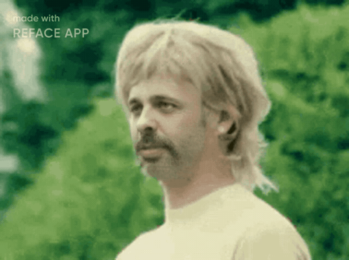 A Man With A Mullet And A Beard Is Made With The Reface App GIF