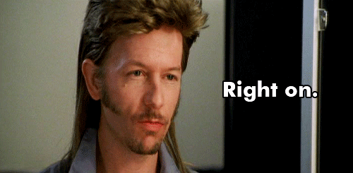 A Man With A Mullet And A Beard Is Standing In Front Of A Door That Says Right On GIF