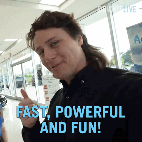 A Man With A Mullet Is Giving A Thumbs Up With The Words Fast Powerful And Fun Below Him GIF