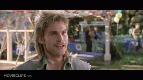 A Man With A Mullet Is Smiling In A Movie Clip From Movieclips.com . GIF