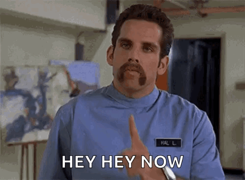 A Man With A Mustache And A Name Tag That Says Hal Is Giving A Thumbs Up And Saying Hey Hey Now . GIF