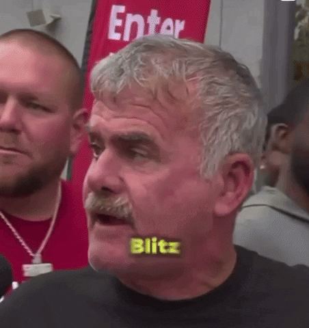 Mustached Man With Blitz Written On Mouth GIF
