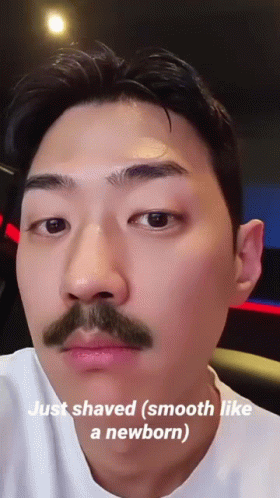 A Man With A Mustache Has The Words Just Shaved Smooth Like A Newborn On His Face GIF