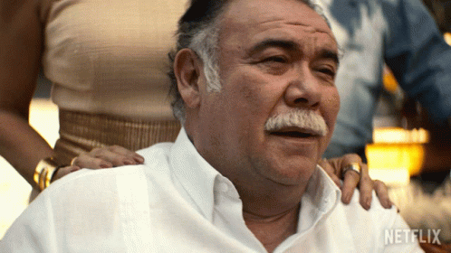 A Man With A Mustache Is Being Comforted By A Woman With A Netflix Logo On The Bottom GIF