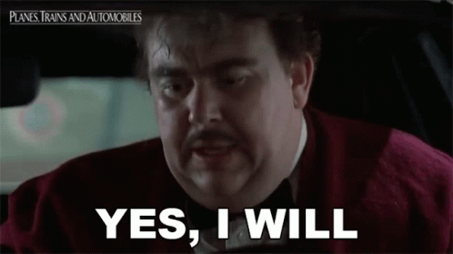 A Man With A Mustache Is Driving A Car And Says `` Yes , I Will '' . GIF