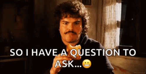 A Man With A Mustache Is Eating A Sandwich And Saying So I Have A Question To Ask ... GIF