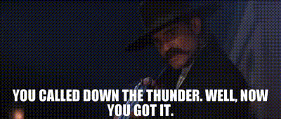 A Man With A Mustache Is Holding A Gun And Says You Called Down The Thunder Well Now You Got It . GIF