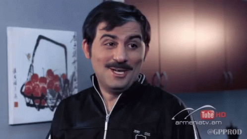A Man With A Mustache Is In Front Of A Sign That Says Youtube Hd GIF