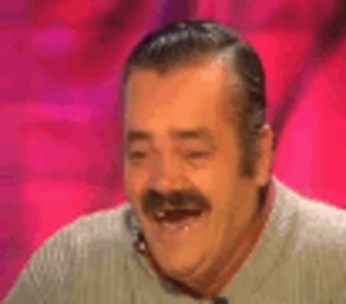 A Man With A Mustache Is Laughing With His Mouth Open And His Eyes Closed . GIF