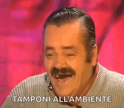 A Man With A Mustache Is Laughing With The Words Tamponi All L' Ambiente Behind Him GIF