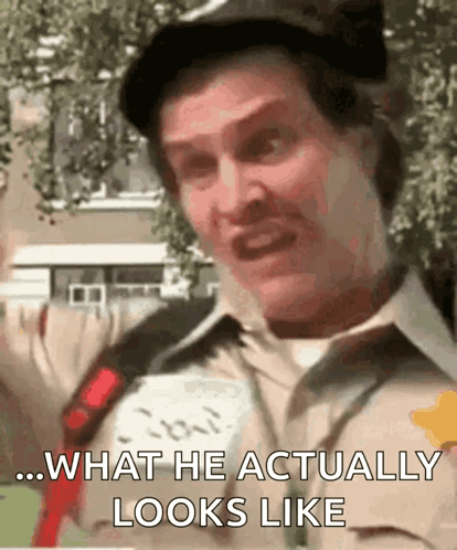 A Man With A Mustache Is Making A Funny Face And Saying What He Actually Looks Like . GIF