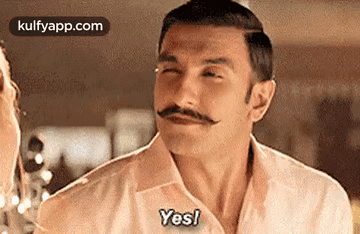 A Man With A Mustache Is Making A Funny Face And Saying `` Yes '' . GIF
