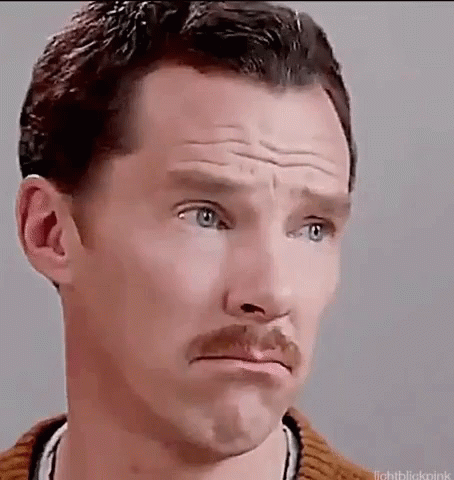 A Man With A Mustache Is Making A Sad Face . GIF