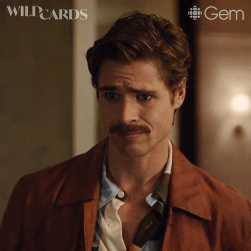 A Man With A Mustache Is On A Poster For Wild Cards GIF