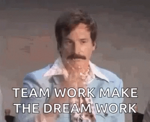 A Man With A Mustache Is Saying `` Team Work Make The Dream Work '' While Drinking From A Glass . GIF