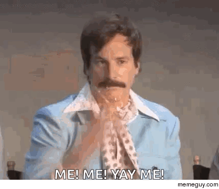 A Man With A Mustache Is Sitting At A Table With His Hands Folded And Saying Me ! Me ! Yay Me ! GIF