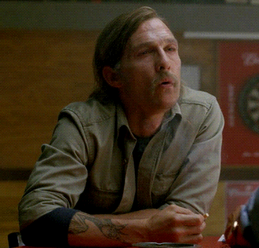 A Man With A Mustache Is Sitting At A Table With The Words Must Be Nice Written On It GIF