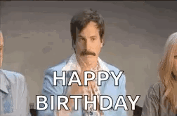A Man With A Mustache Is Sitting Next To A Woman And Says `` Happy Birthday '' . GIF
