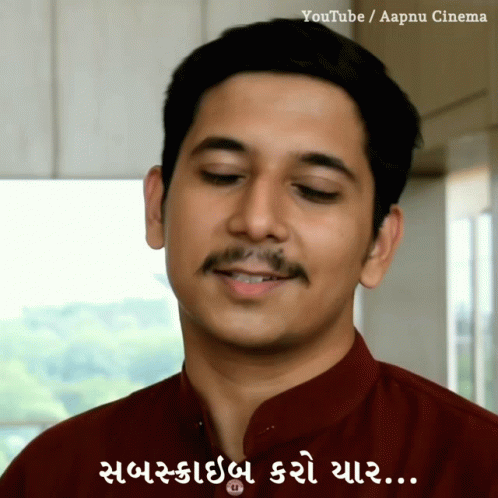 A Man With A Mustache Is Smiling With A Caption That Says Youtube / Aapnu Cinema GIF