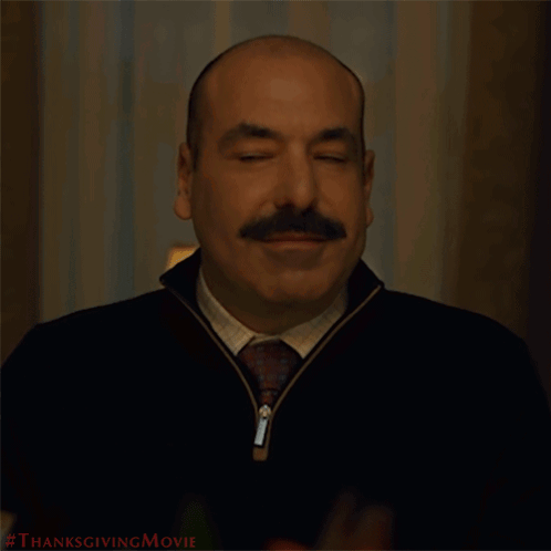 A Man With A Mustache Is Smiling With The Words Let 'S Eat Behind Him GIF