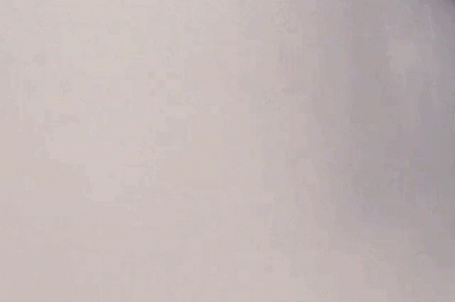 A Man With A Mustache Is Standing In A Bathtub With Smoke Coming Out Of His Nose . GIF