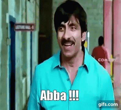 A Man With A Mustache Is Standing In Front Of A Building And Says Abba !!! GIF