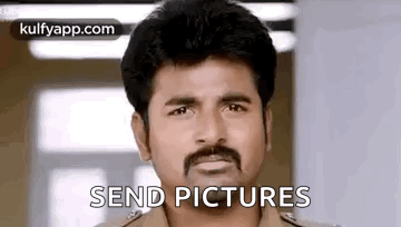 A Man With A Mustache Is Standing In Front Of A Window And Saying `` Send Pictures '' . GIF