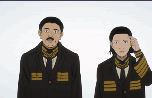 A Man With A Mustache Is Standing Next To A Woman In A Black Suit GIF