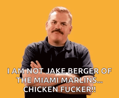 A Man With A Mustache Is Standing With His Arms Crossed And Says I Am Not Jake Berger GIF