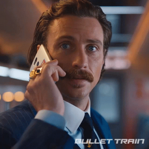 Man With Mustache Talking On Cell Phone Bullet Train GIF