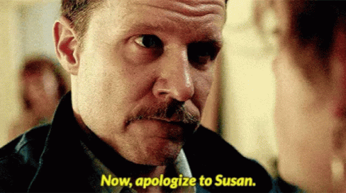 A Man With A Mustache Is Talking To A Woman And Says Now Apologize To Susan GIF
