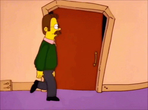 A Man With A Mustache Is Walking Through A Door . GIF