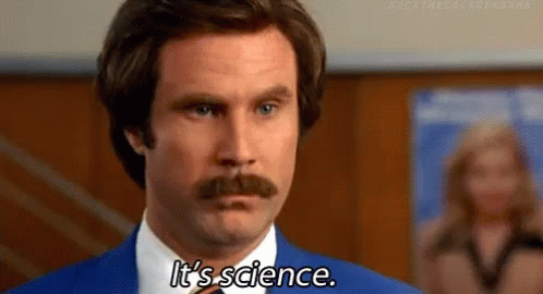 A Man With A Mustache Is Wearing A Blue Suit And Tie And Saying It 'S Science . GIF