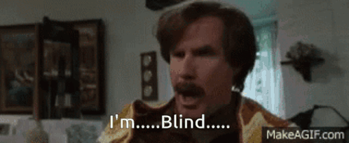 A Man With A Mustache Says I 'M Blind In A Living Room . GIF