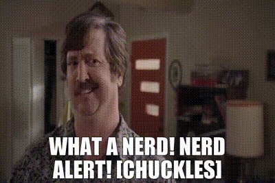A Man With A Mustache Says " What A Nerd ! Nerd Alert ! Chuckles ! " GIF