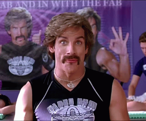 A Man With A Mustache Wears A Globe Gym Shirt GIF