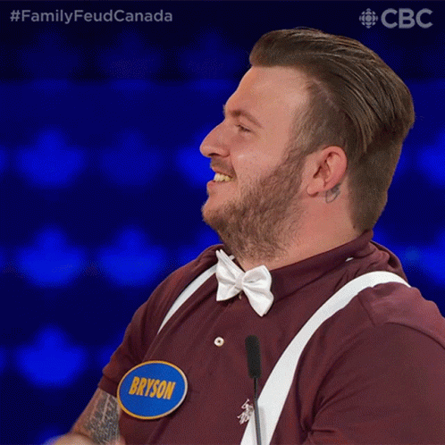 A Man With A Name Tag That Says Bryson Is Laughing GIF