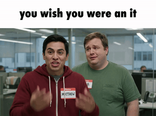 A Man With A Name Tag That Says Matthew Is Standing Next To Another Man GIF