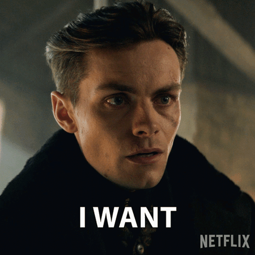 A Man With A Netflix Logo Behind Him GIF