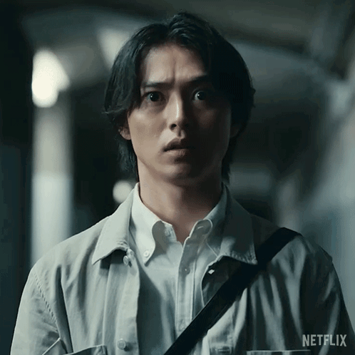 A Man With A Netflix Logo On His Sleeve GIF