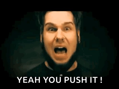 A Man With A Nose Ring Is Screaming With His Mouth Open And The Words `` Yeah You Push It '' Written Below Him . GIF