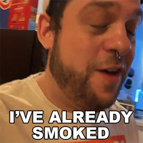 A Man With A Nose Ring Is Smoking A Cigarette And Says I 'Ve Already Smoked GIF