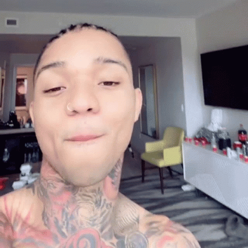 A Man With A Nose Ring Is Taking A Selfie GIF